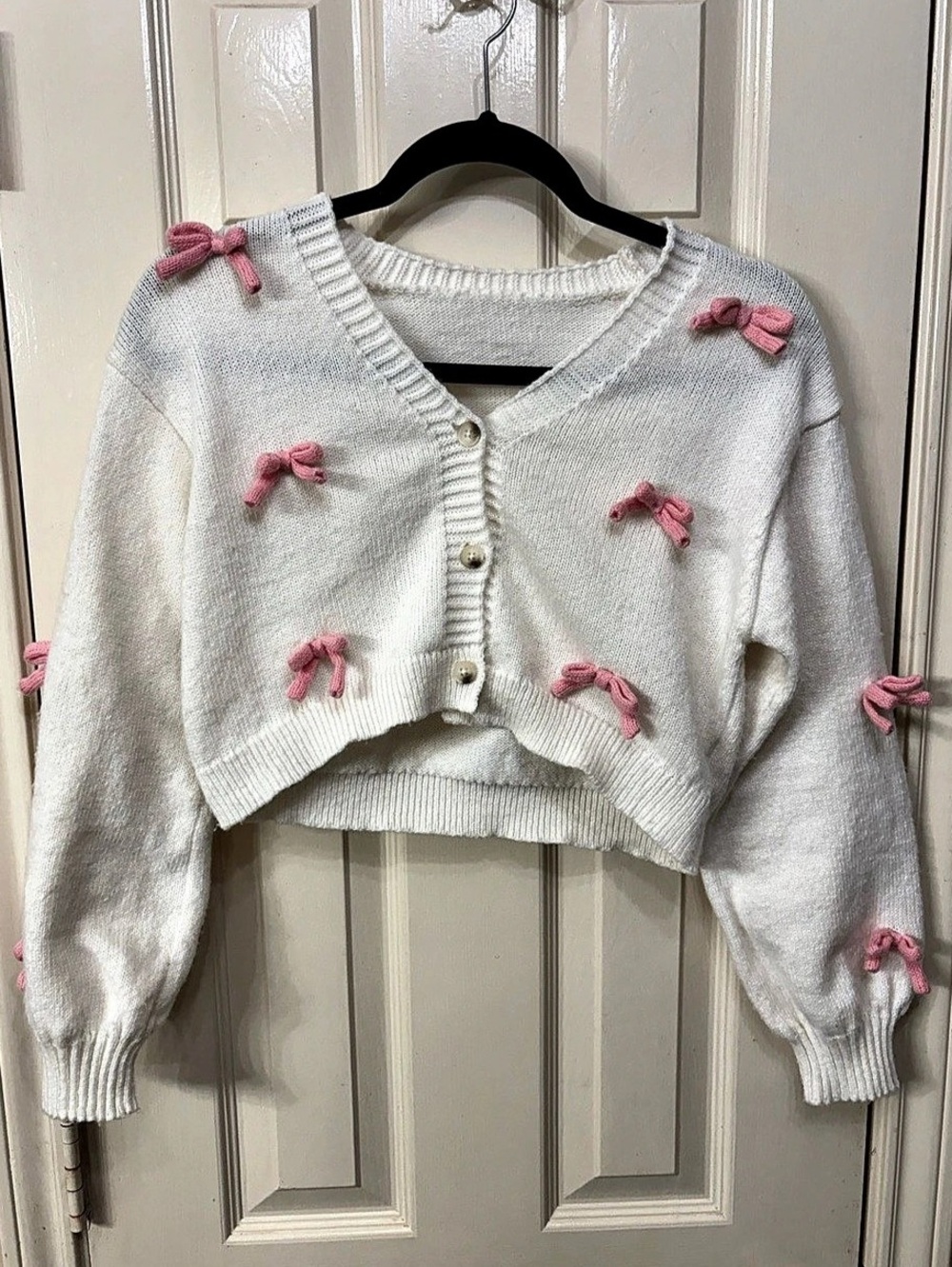 White Cropped Girls Knitted Cardigan with Pink Bows